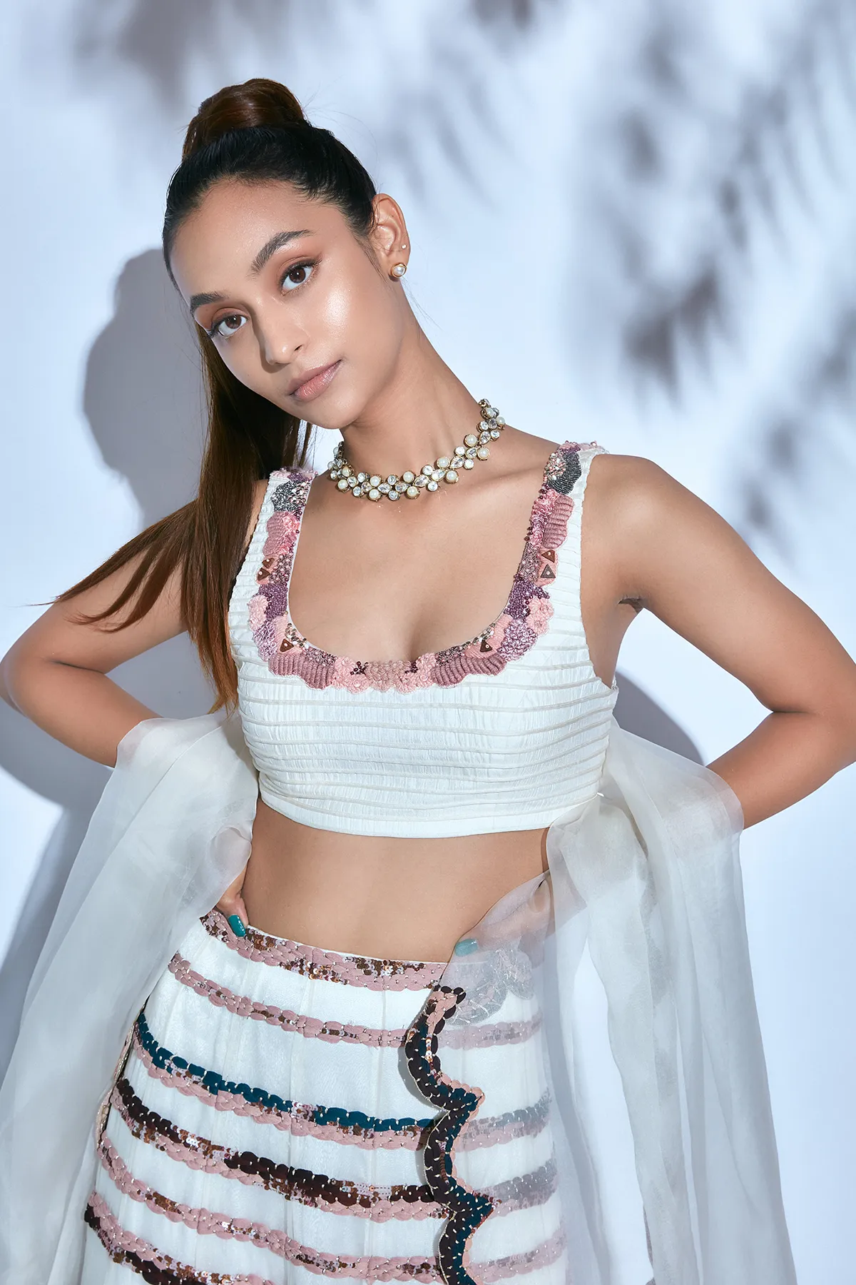 Hand-embroidered Corded White Blouse paired with Hand-embroidered Skirt and Organza Dupatta