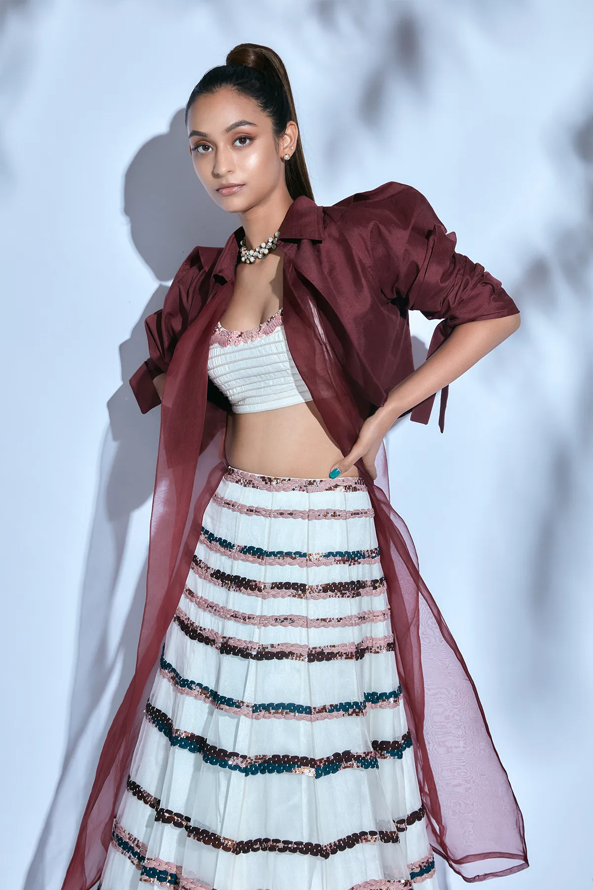 Hand-embroidered Corded White Blouse paired with Hand-embroidered Skirt and Organza Dupatta